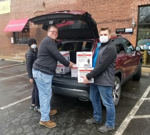 Paul Hamilton and helpers unload donated supplies for WashU dialysis centers