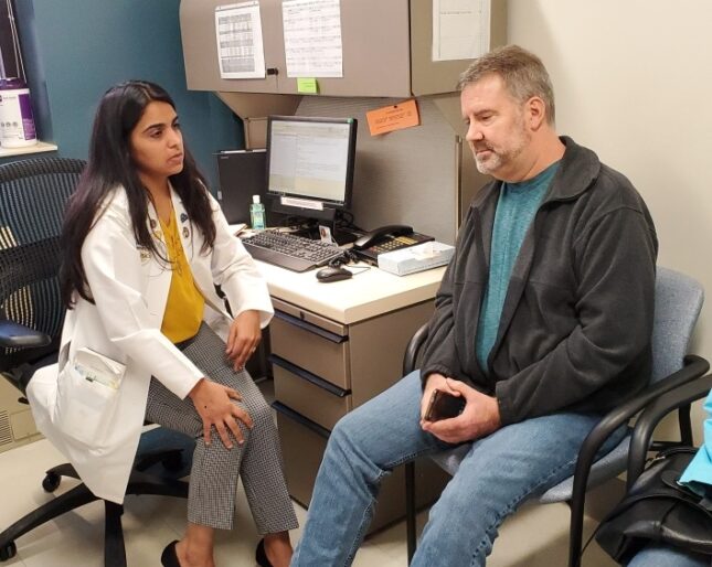 Dr. Java consults with David Tanner, a kidney transplant patient.