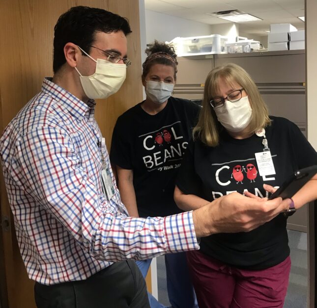 Dr. Charbel Khoury and home dialysis nurse coordinators Cheryl Cress and Katie Keene greet a previous home hemodialysis patient who recently received a transplant.
